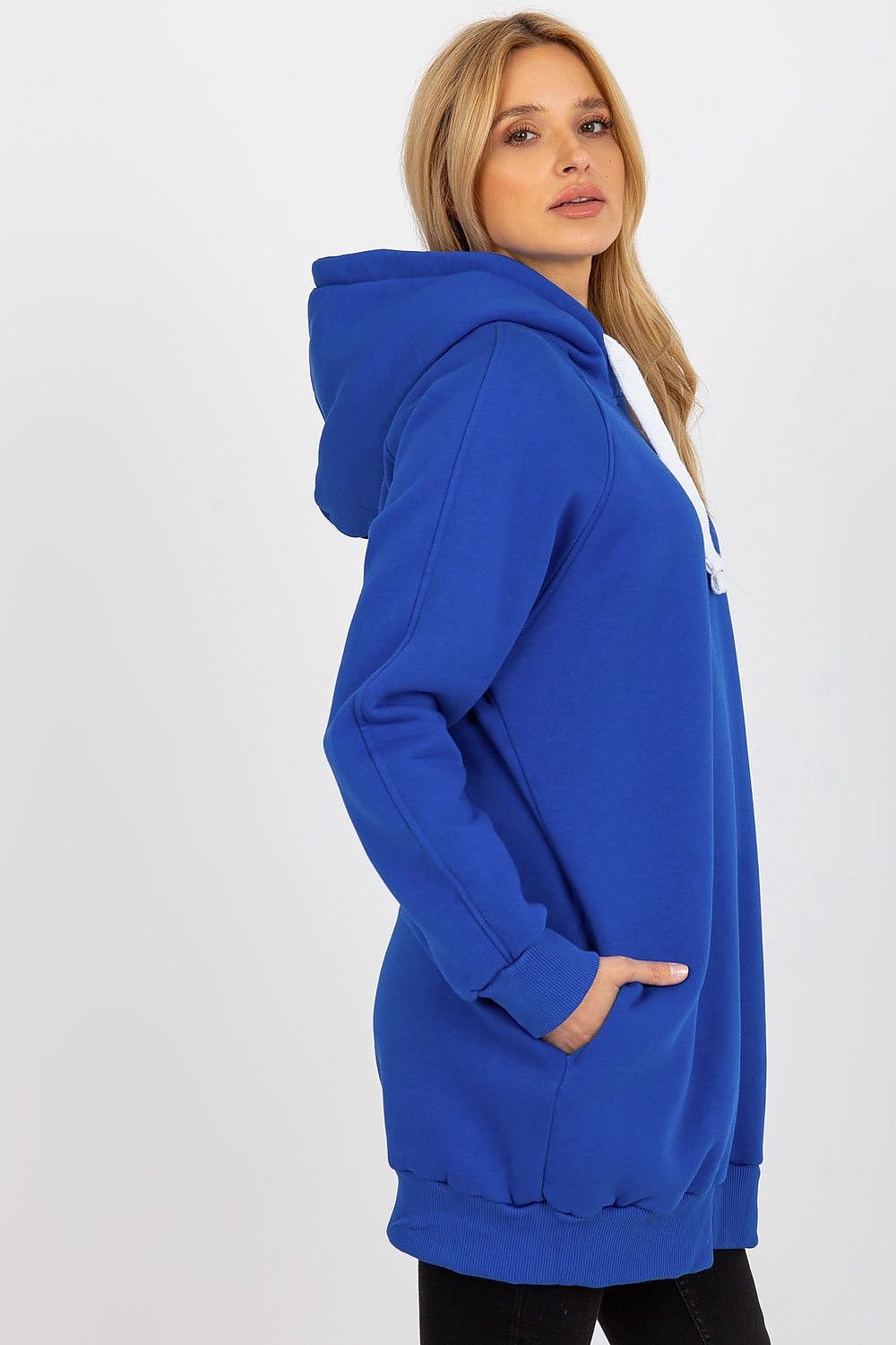 Woman wearing a blue hoodie on a white background