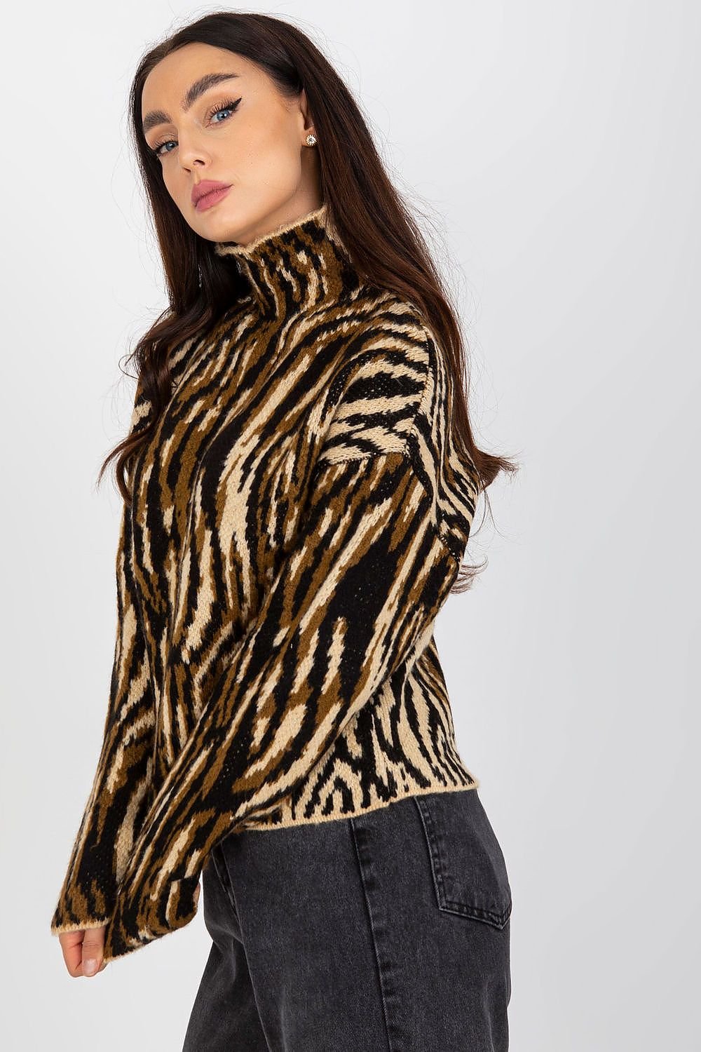 Woman wearing a zebra print sweater against a white background