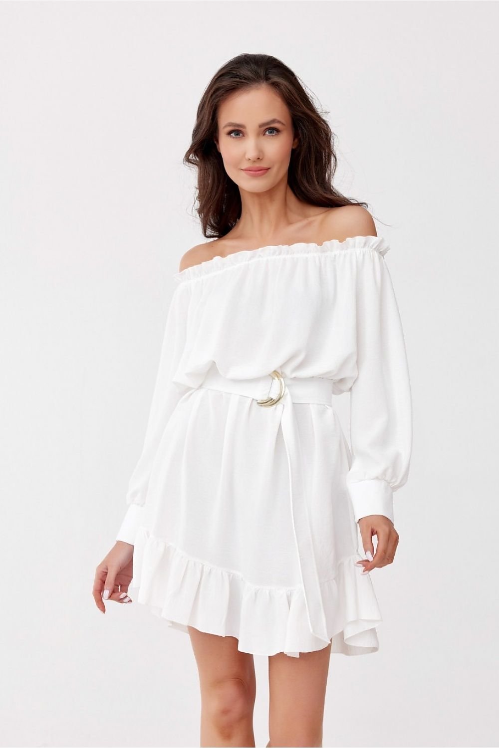 Woman wearing a white off-shoulder dress on a white background