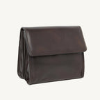 "Full-grain calfskin leather shoulder bag with three compartments, zippered rear pocket, and adjustable shoulder strap"