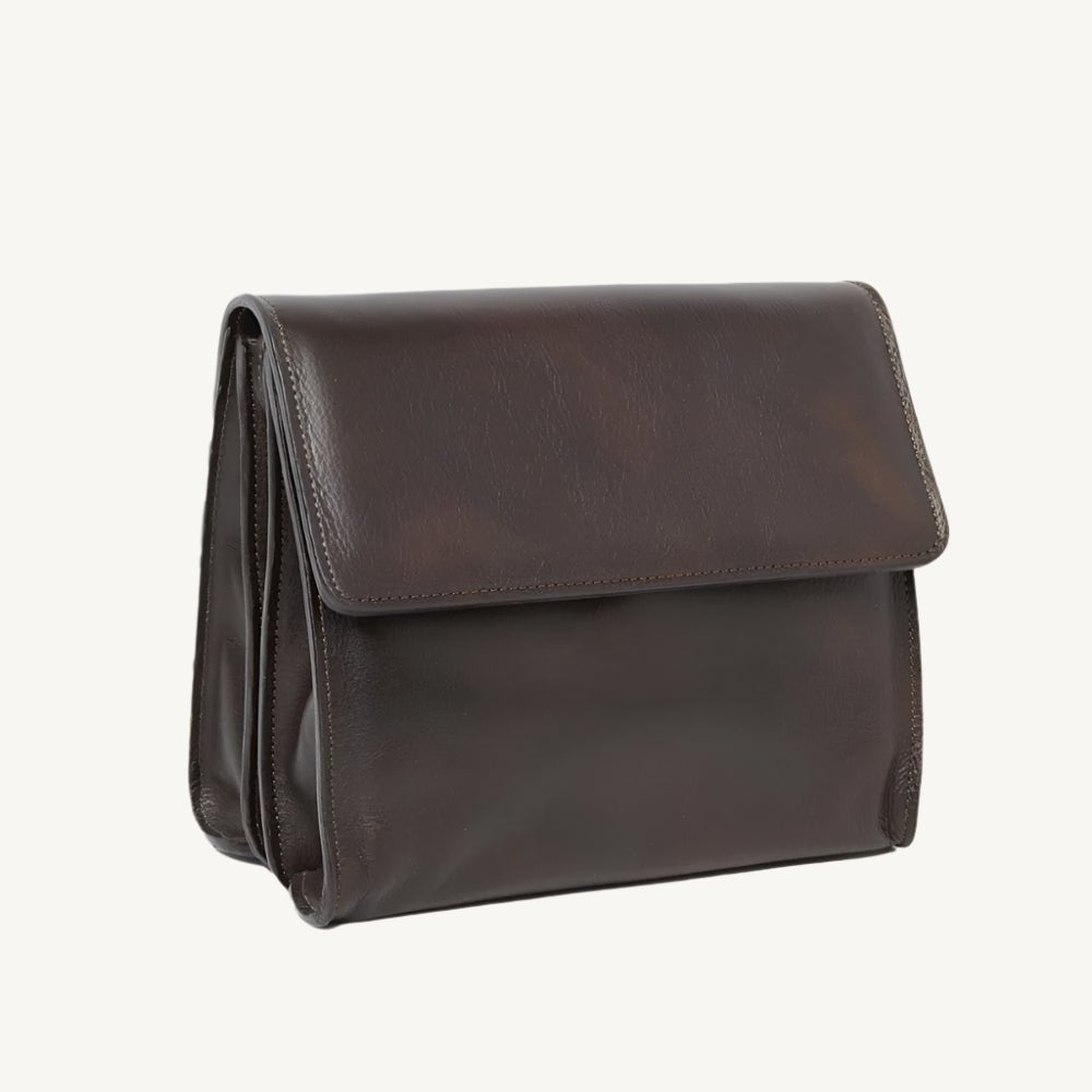 "Full-grain calfskin leather shoulder bag with three compartments, zippered rear pocket, and adjustable shoulder strap"