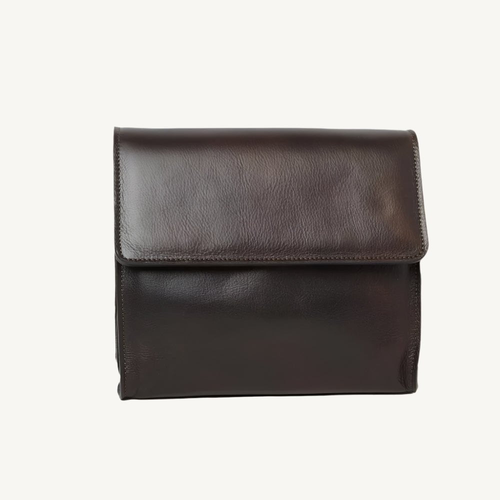 "Full-grain calfskin leather shoulder bag with three compartments, zippered rear pocket, and adjustable shoulder strap"