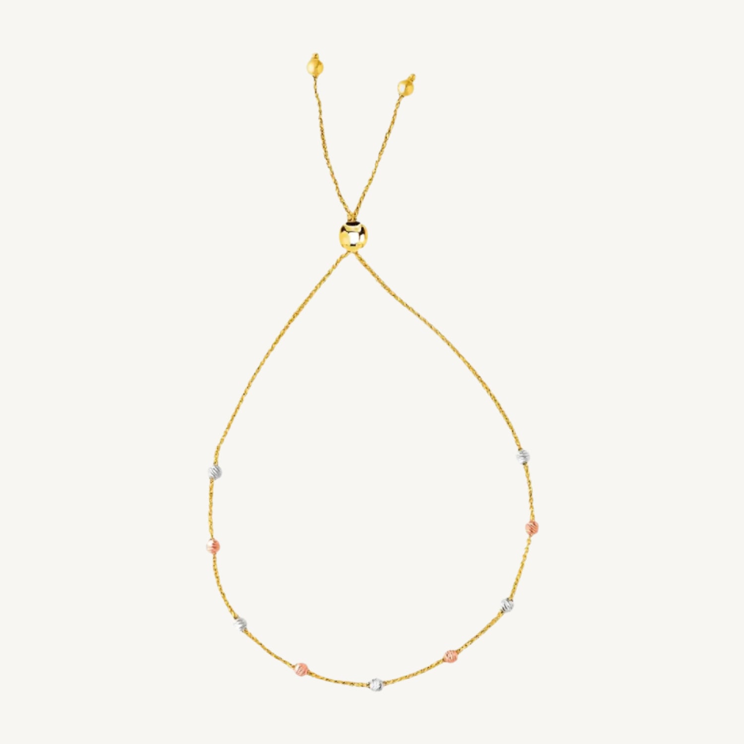 14k tri-color gold lariat bracelet with 5.00 mm textured bead stations in yellow, white, and rose gold.