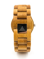 Wooden watch with a black face on a white background