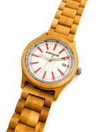Wooden watch with red accents on a white background