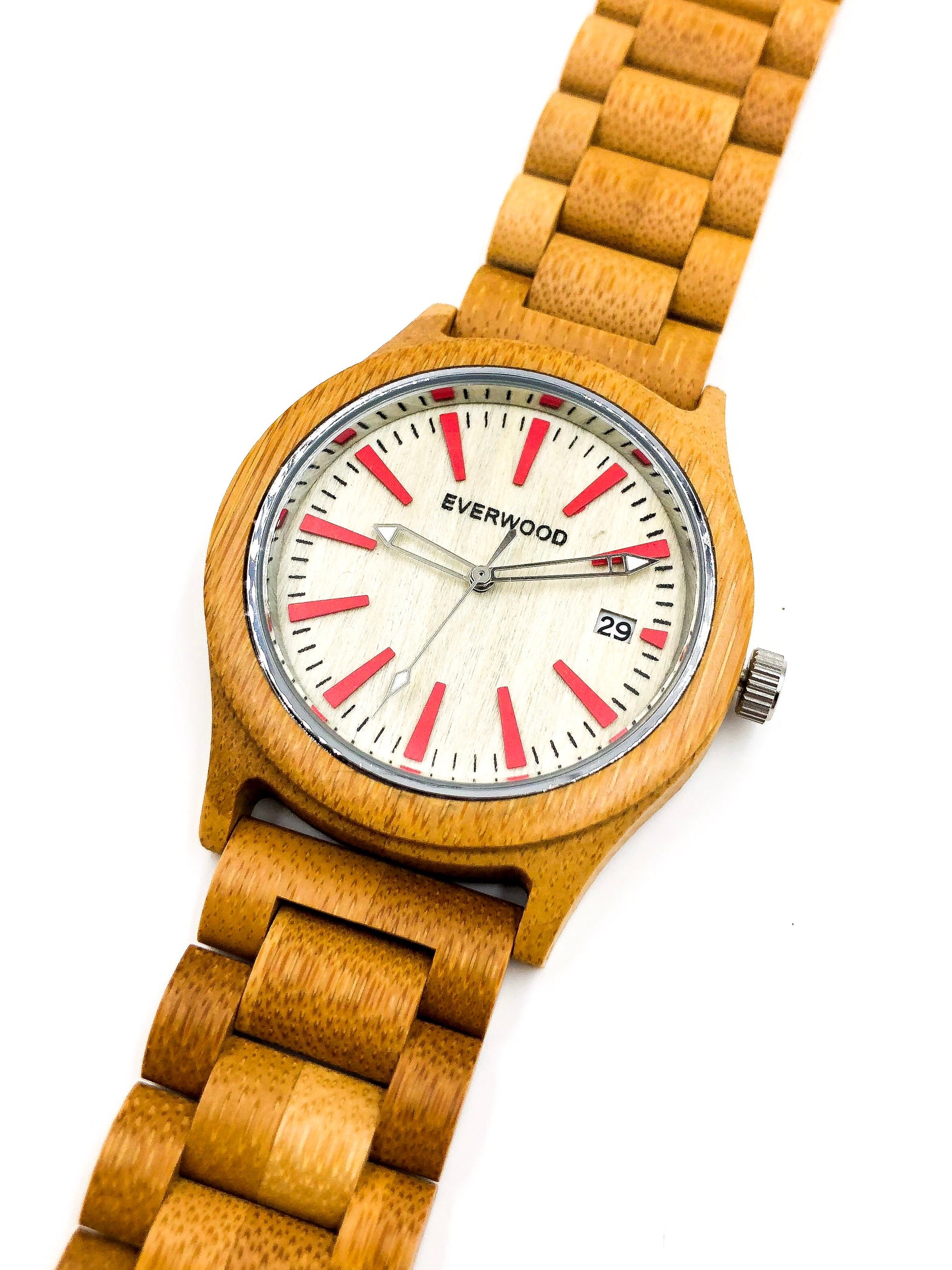 Wooden watch with red accents on a white background