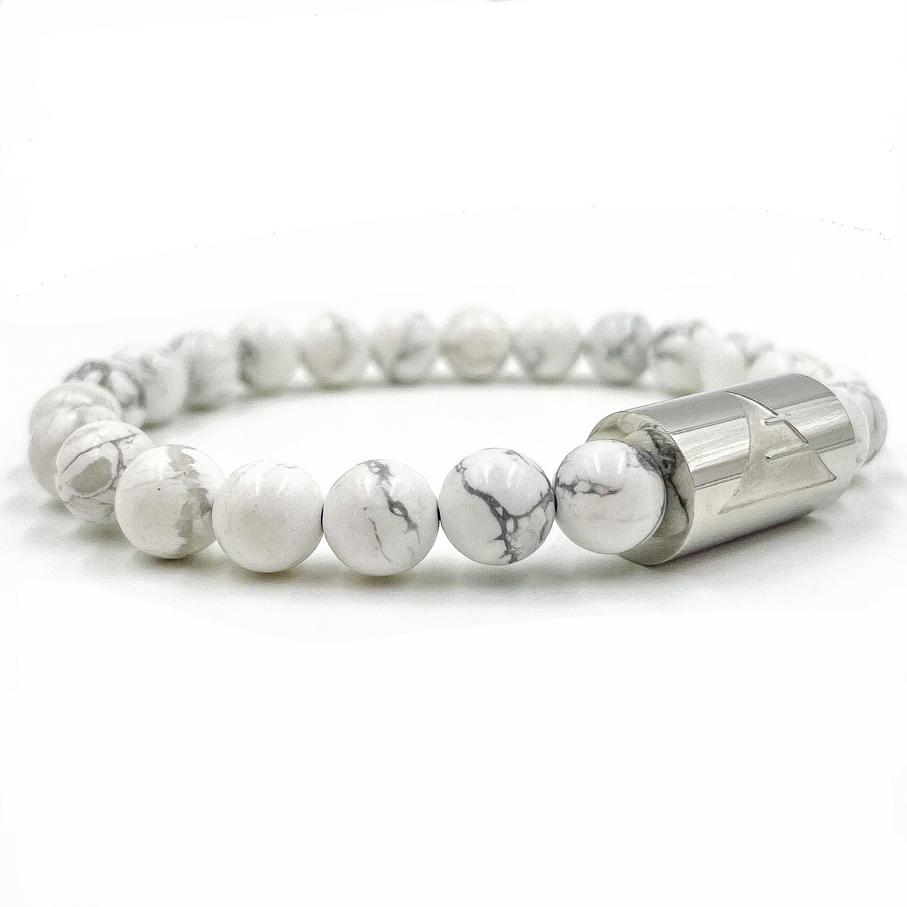 White marbled beaded bracelet with a silver cylindrical clasp on a white background