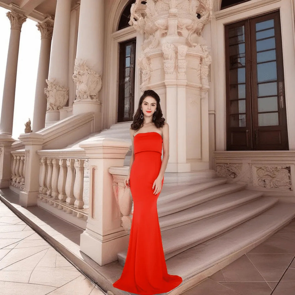 Elegant woman wearing the Evelyn Belluci Red Strapless Gown, featuring a sculpted neckline and flowing maxi silhouette, perfect for glamorous evening occasions.