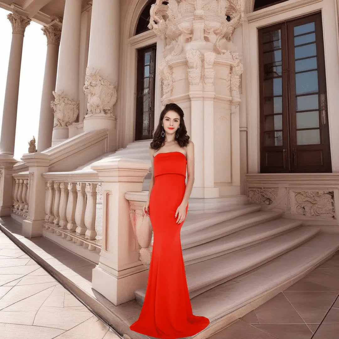 Elegant woman wearing the Evelyn Belluci Red Strapless Gown, featuring a sculpted neckline and flowing maxi silhouette, perfect for glamorous evening occasions.