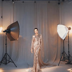 Gold Sequin Ball Gown, a dazzling and elegant dress adorned with shimmering sequins, perfect for making a glamorous entrance at any formal event. Featuring a voluminous skirt and fitted bodice, this gown exudes luxury and sophistication.