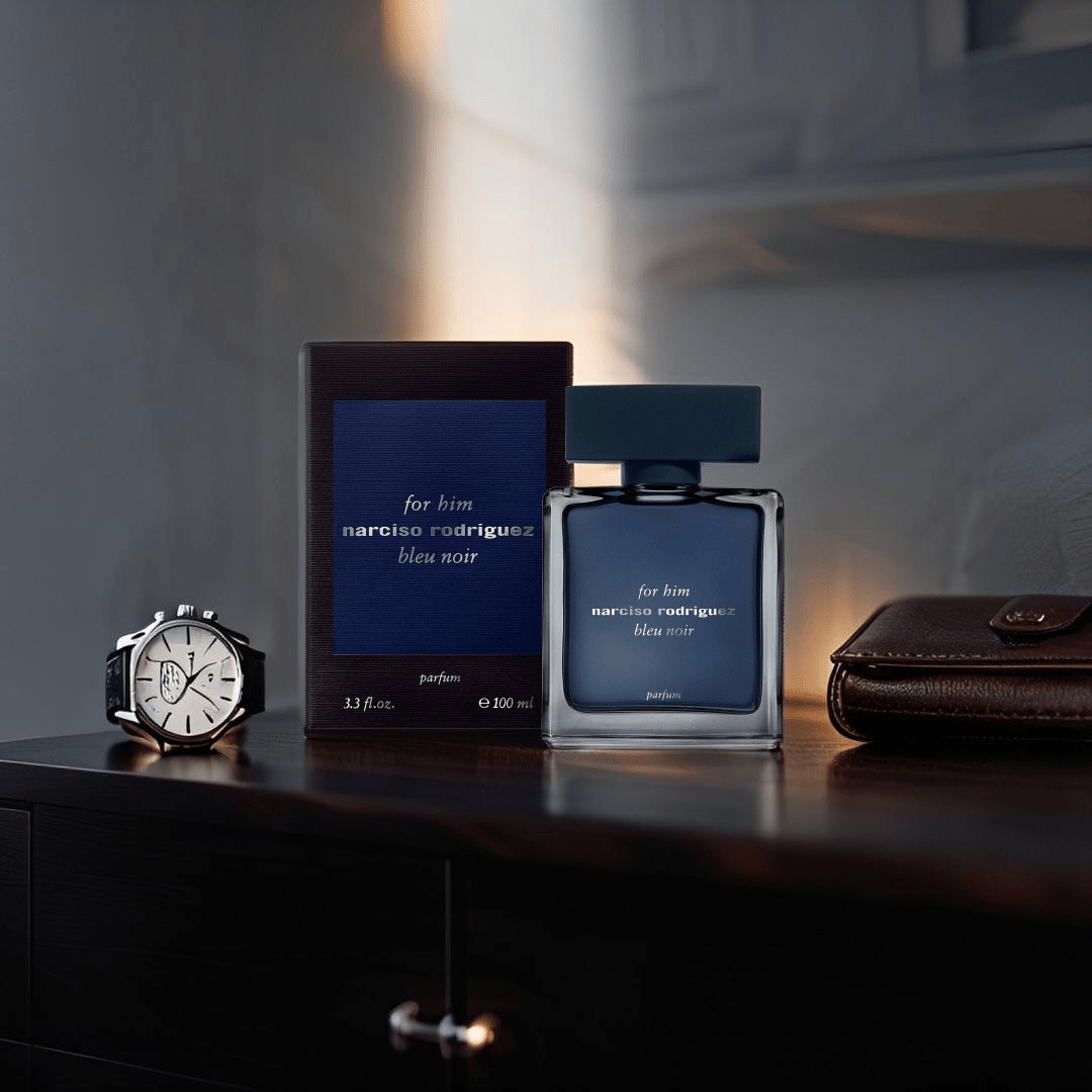 "Narciso Rodriguez For Him Bleu Noir Parfum 3.3 oz – sleek dark blue bottle with minimalist design, accompanied by its matching deep blue box."