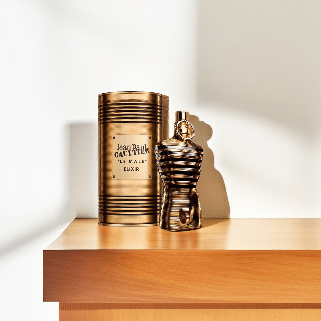 "Jean Paul Gaultier Le Male Elixir 4.2 oz Parfum spray for men – intense, warm and seductive fragrance in a bold golden-black torso bottle."