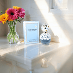 Marc Jacobs Daisy Dream perfume bottle — a light and airy fruity-floral fragrance capturing the youthful, whimsical spirit of the Daisy collection.