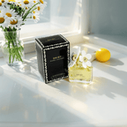 "Marc Jacobs Daisy Eau de Toilette 1.7 oz – a clear glass bottle filled with golden-hued fragrance, topped with a whimsical white daisy-adorned cap, reflecting a playful and feminine design."