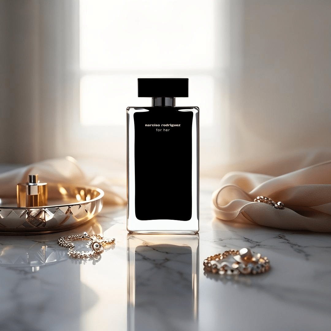 "Narciso Rodriguez For Her Eau de Toilette 5 oz – elegant rectangular bottle with soft pink label and black cap, presented alongside its matching blush pink box."