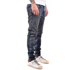 Diesel blue jeans with a raw denim finish, styled flat to show rugged texture and authentic edge — bold design with confident attitude.