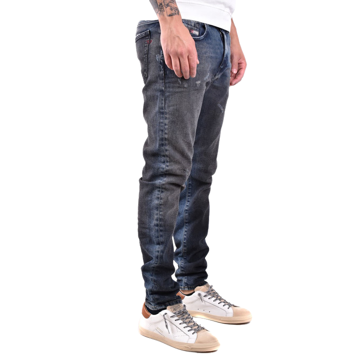 Diesel blue jeans with a raw denim finish, styled flat to show rugged texture and authentic edge — bold design with confident attitude.