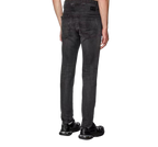 Diesel black jeans laid flat, featuring a slim fit with stretch fabric — blending modern edge with all-day comfort.