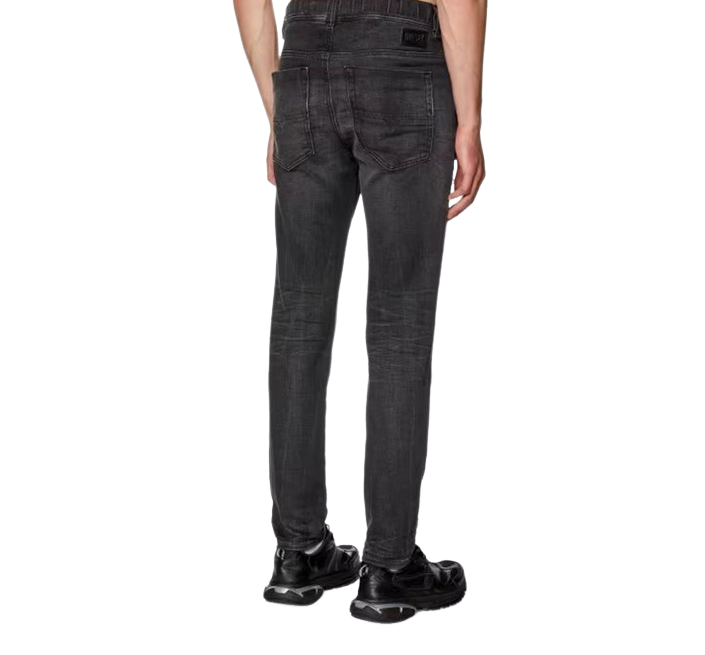 Diesel black jeans laid flat, featuring a slim fit with stretch fabric — blending modern edge with all-day comfort.