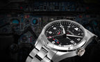 Silver watch with black dial on a background of aircraft instruments