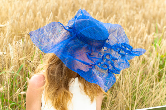 "Handmade Greed Hat with embossed letters, crafted on wooden lasts, bold statement accessory celebrating beauty and presence, from the Seven Sins collection."