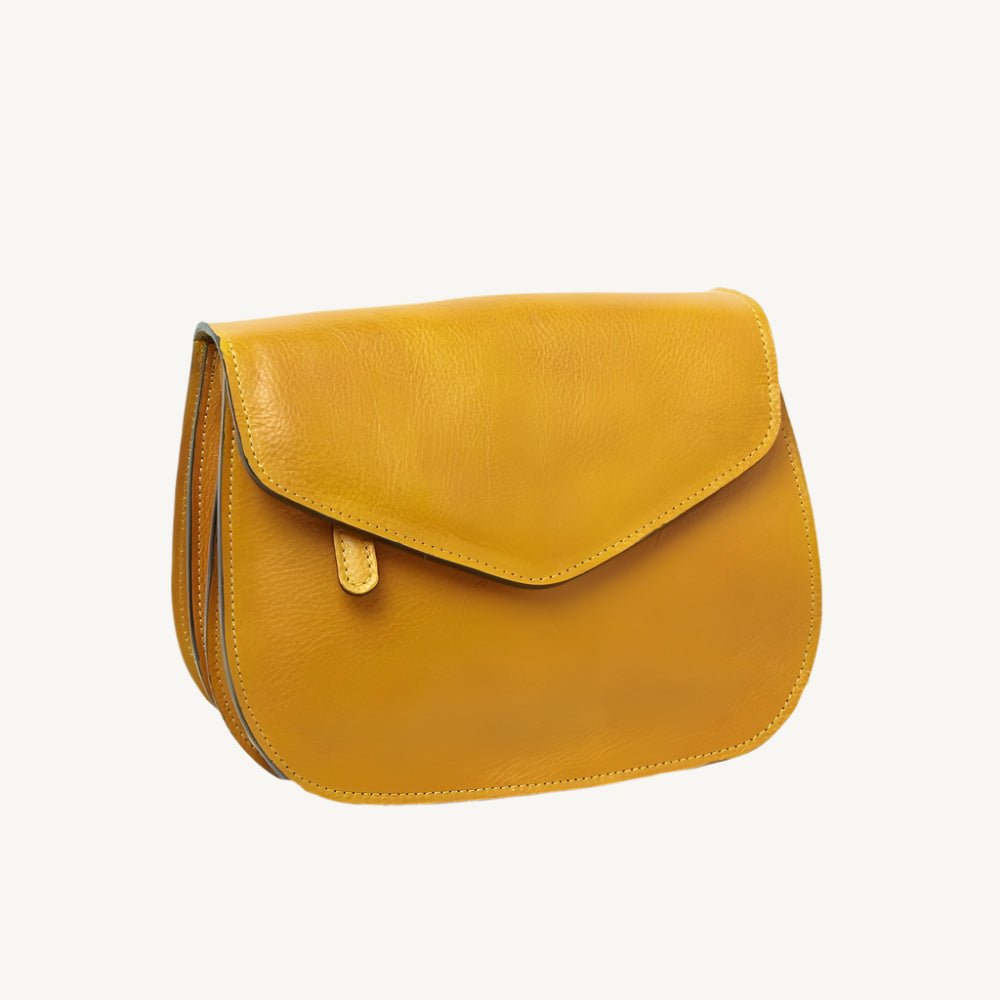 Elegant full-grain calfskin leather shoulder bag with zippered front and back pockets, three compartments, and adjustable strap.