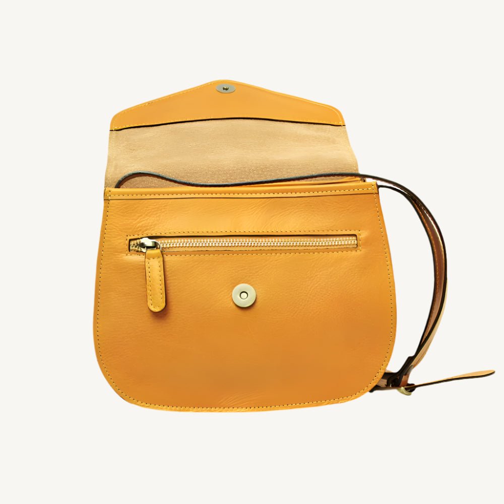 Elegant full-grain calfskin leather shoulder bag with zippered front and back pockets, three compartments, and adjustable strap.