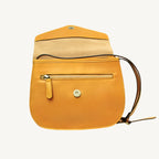 Elegant full-grain calfskin leather shoulder bag with zippered front and back pockets, three compartments, and adjustable strap.