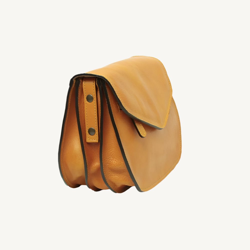 Elegant full-grain calfskin leather shoulder bag with zippered front and back pockets, three compartments, and adjustable strap.