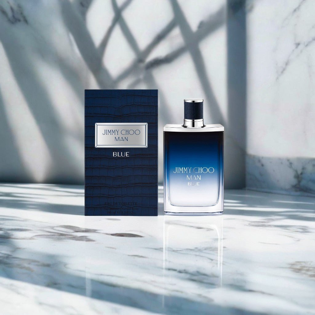 "Jimmy Choo Man Blue 3.3 oz Eau de Toilette Spray – a sleek, gradient blue bottle with a silver-toned cap, embodying modern masculinity and freshness."
