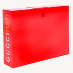 "Gucci Rush 2.5 oz Eau de Toilette Spray for Women – bold red rectangular bottle with minimalist design, reflecting the vibrant and sensual fragrance within."