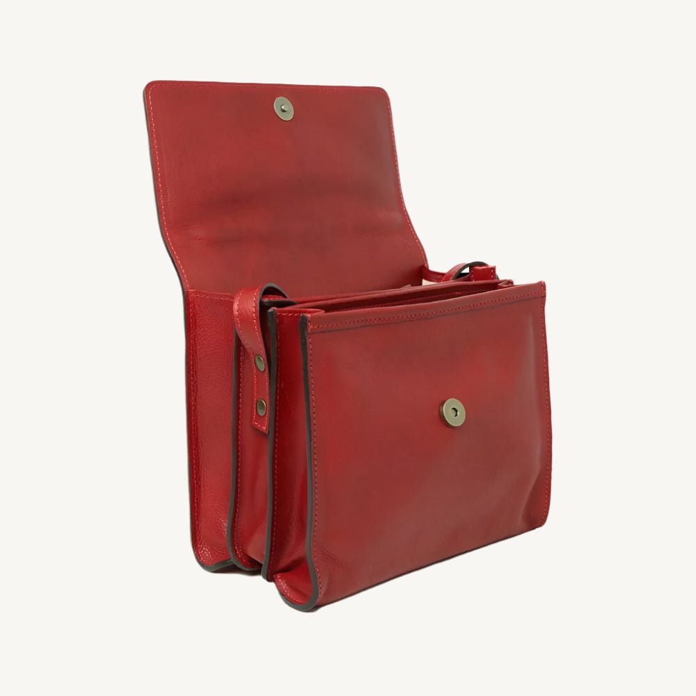 "Full-grain calfskin leather shoulder bag with three compartments, zip closure, rear zip pocket, and adjustable strap"
