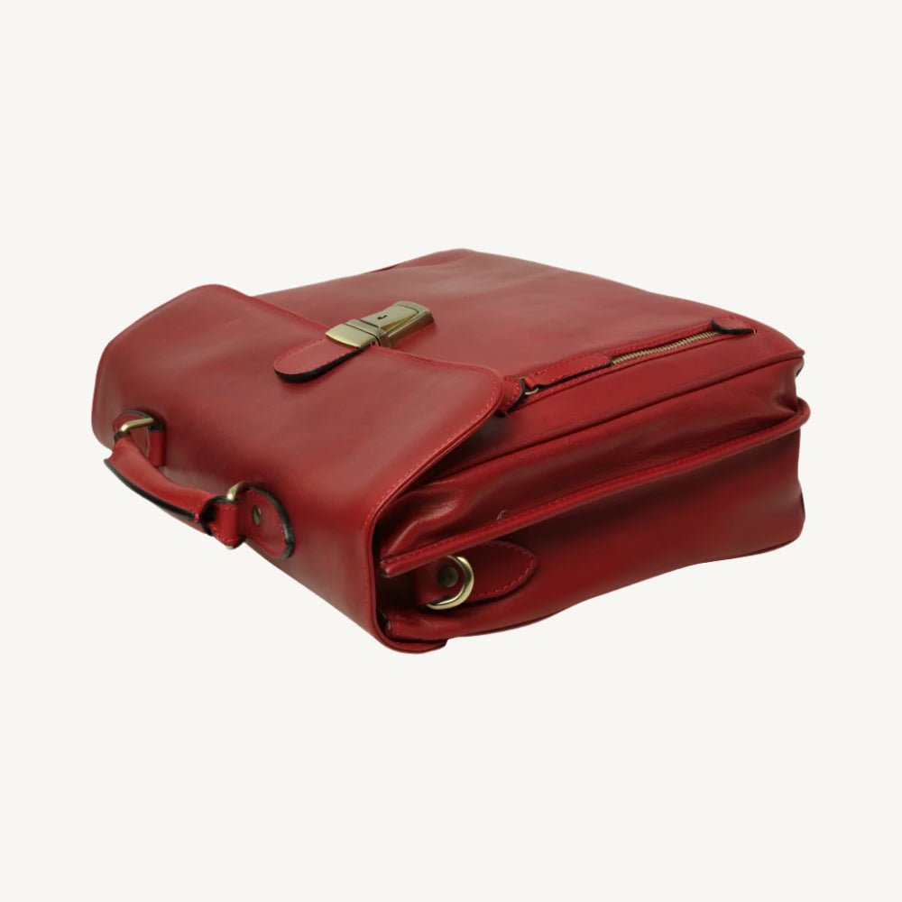 "Stylish leather messenger bag featuring synthetic lining, a laptop compartment, phone pocket, pen holders, external zip pocket, clasp flap closure, and adjustable removable shoulder strap with pad."