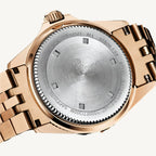 Revue Thommen Diver men’s automatic watch with black dial, gold-tone stainless steel strap, luminous hands, and 300m water resistance, Swiss made.