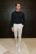 Ivory cotton chino trousers — lightweight, breathable, and elegant, perfect for spring and summer. A refined choice for casual and smart-casual wear.