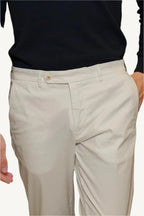 Ivory cotton chino trousers — lightweight, breathable, and elegant, perfect for spring and summer. A refined choice for casual and smart-casual wear.