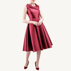 Versatile vintage-inspired dress crafted from pearlescent mikado — lightweight and voluminous with a fitted top, sculpted collar, and a hidden zipper for nursing mothers. Suitable for both daytime and evening events.