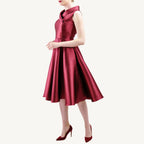 Versatile vintage-inspired dress crafted from pearlescent mikado — lightweight and voluminous with a fitted top, sculpted collar, and a hidden zipper for nursing mothers. Suitable for both daytime and evening events.