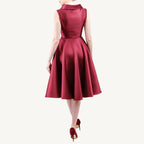 Versatile vintage-inspired dress crafted from pearlescent mikado — lightweight and voluminous with a fitted top, sculpted collar, and a hidden zipper for nursing mothers. Suitable for both daytime and evening events.