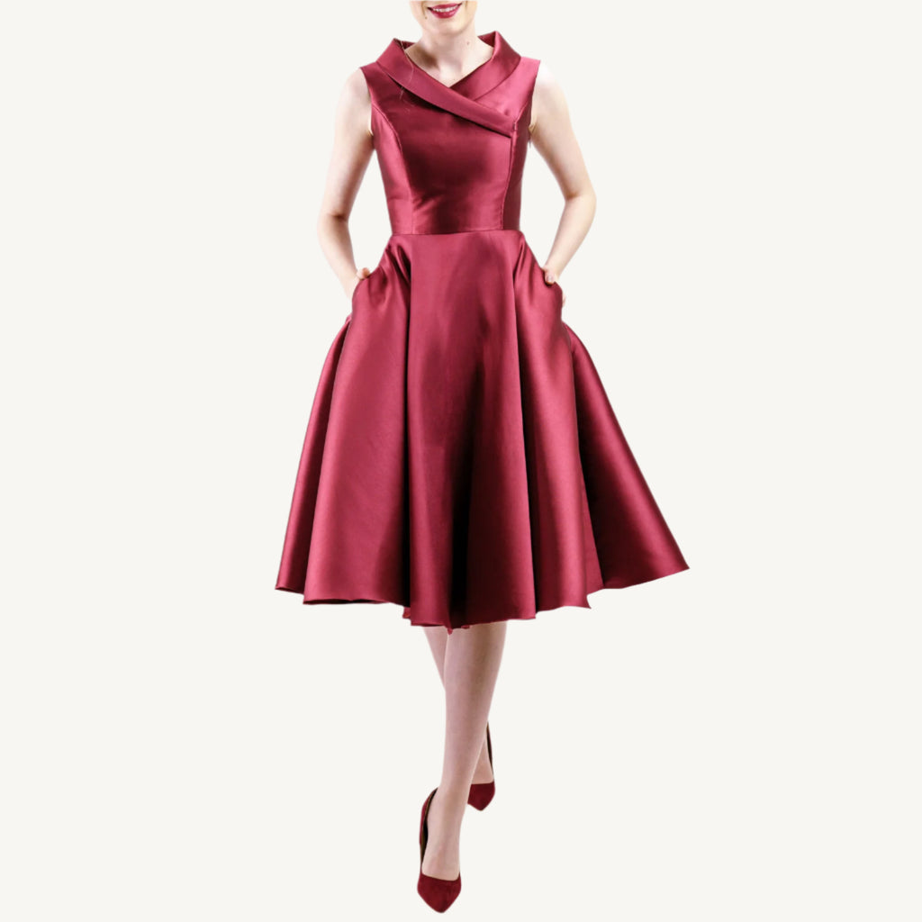 Versatile vintage-inspired dress crafted from pearlescent mikado — lightweight and voluminous with a fitted top, sculpted collar, and a hidden zipper for nursing mothers. Suitable for both daytime and evening events.