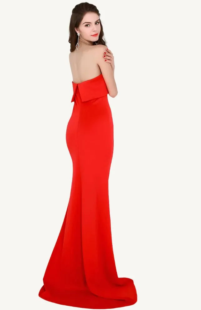 Elegant woman wearing the Evelyn Belluci Red Strapless Gown, featuring a sculpted neckline and flowing maxi silhouette, perfect for glamorous evening occasions.