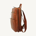 Full-grain leather backpack with two compartments (one padded for laptop), interior zip pocket, two exterior zip pockets, adjustable leather straps, and synthetic lining. Size 30x39x11 cm / 12x15.5x4.5 in, weight 1.3 kg.