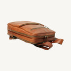Full-grain leather backpack with two compartments (one padded for laptop), interior zip pocket, two exterior zip pockets, adjustable leather straps, and synthetic lining. Size 30x39x11 cm / 12x15.5x4.5 in, weight 1.3 kg.