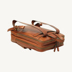 Full-grain leather backpack with two compartments (one padded for laptop), interior zip pocket, two exterior zip pockets, adjustable leather straps, and synthetic lining. Size 30x39x11 cm / 12x15.5x4.5 in, weight 1.3 kg.